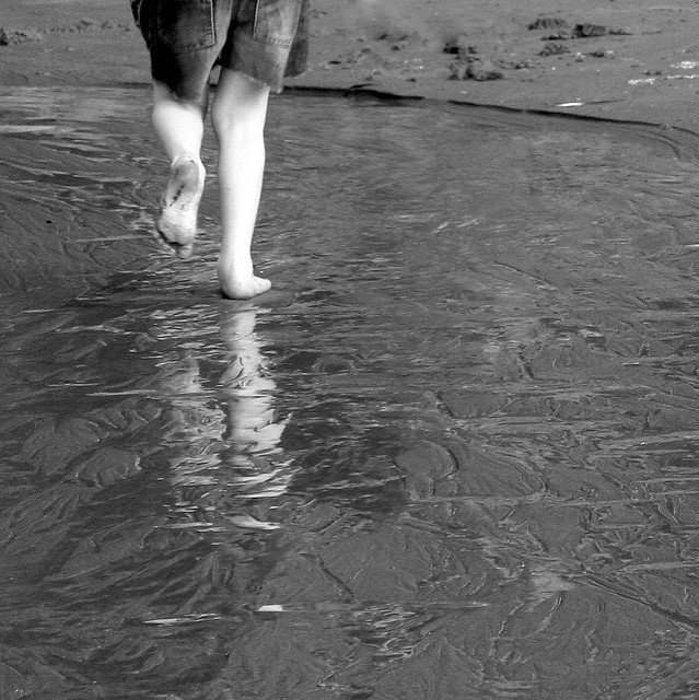 Boy running in the surf